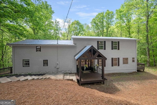 rear view of house with metal roof
