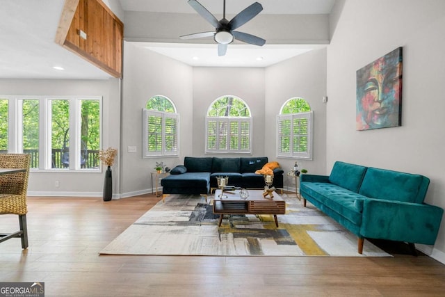 living room featuring baseboards, recessed lighting, ceiling fan, and wood finished floors