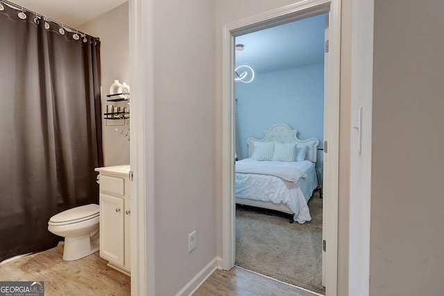 5601 Savannah River Rd, Atlanta, GA 30349 - ensuite bathroom featuring vanity, ensuite bathroom, wood finished floors, and toilet