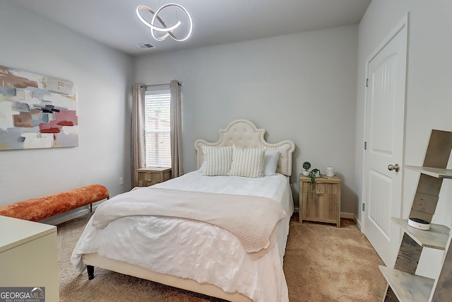 5601 Savannah River Rd, Atlanta, GA 30349 - carpeted bedroom featuring baseboards, visible vents, and a chandelier