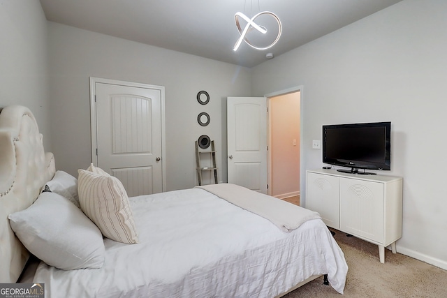 5601 Savannah River Rd, Atlanta, GA 30349 - bedroom featuring an inviting chandelier, baseboards, and carpet