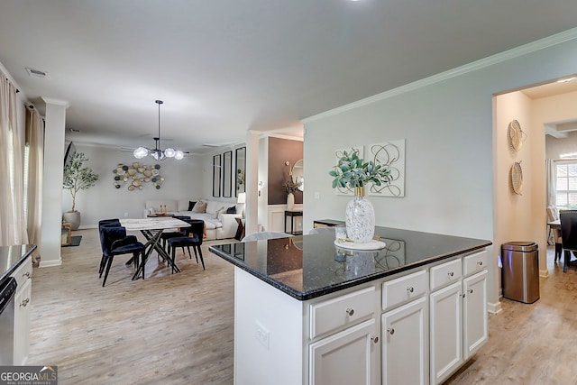 5601 Savannah River Rd, Atlanta, GA 30349 - kitchen with crown molding, open floor plan, light wood-style flooring, and white cabinetry