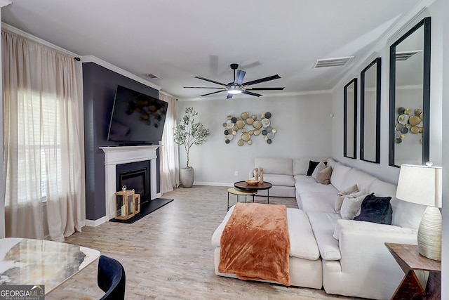 5601 Savannah River Rd, Atlanta, GA 30349 - living room with baseboards, a glass covered fireplace, ceiling fan, and visible vents