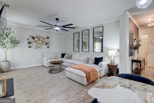 5601 Savannah River Rd, Atlanta, GA 30349 - living room featuring ceiling fan, baseboards, wood finished floors, visible vents, and ornamental molding