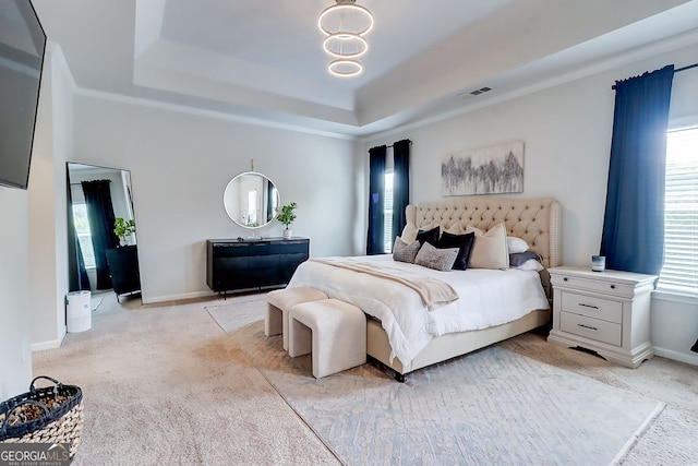 5601 Savannah River Rd, Atlanta, GA 30349 - bedroom with visible vents, a raised ceiling, baseboards, and light colored carpet