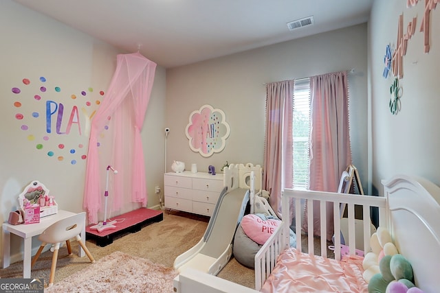 5601 Savannah River Rd, Atlanta, GA 30349 - carpeted bedroom featuring a nursery area and visible vents