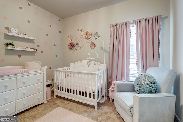 5601 Savannah River Rd, Atlanta, GA 30349 - bedroom featuring carpet flooring, a nursery area, and multiple windows