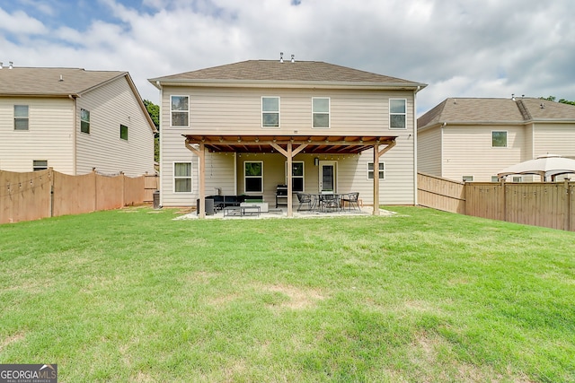 5601 Savannah River Rd, Atlanta, GA 30349 - back of house featuring a patio, a fenced backyard, and a lawn