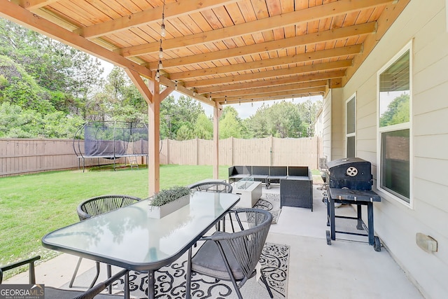 5601 Savannah River Rd, Atlanta, GA 30349 - view of patio with a fenced backyard, outdoor dining area, an outdoor hangout area, and a trampoline