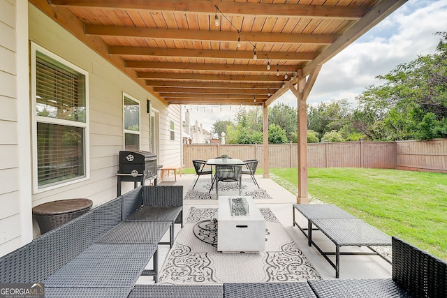 5601 Savannah River Rd, Atlanta, GA 30349 - view of patio featuring a fenced backyard, an outdoor living space with a fire pit, outdoor dining space, and grilling area