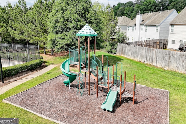 5601 Savannah River Rd, Atlanta, GA 30349 - communal playground featuring a lawn and fence