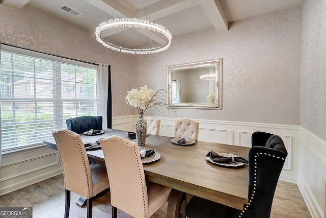 5601 Savannah River Rd, Atlanta, GA 30349 - dining space featuring visible vents, a wealth of natural light, and wood finished floors