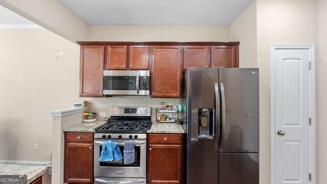 1155 Hampton Oaks Dr, Alpharetta, GA 30004 - kitchen featuring appliances with stainless steel finishes and light stone counters