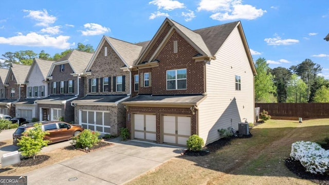 1155 Hampton Oaks Dr, Alpharetta, GA 30004 - view of front of house with fence, an attached garage, central AC, brick siding, and concrete driveway