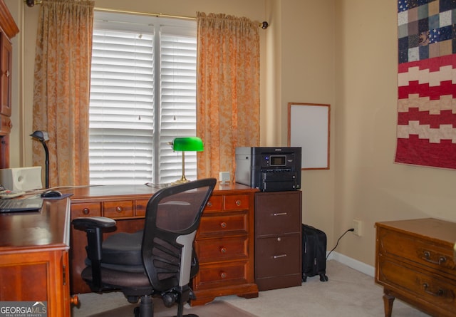 office area with light colored carpet and baseboards