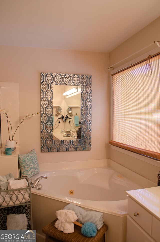 full bathroom with a whirlpool tub