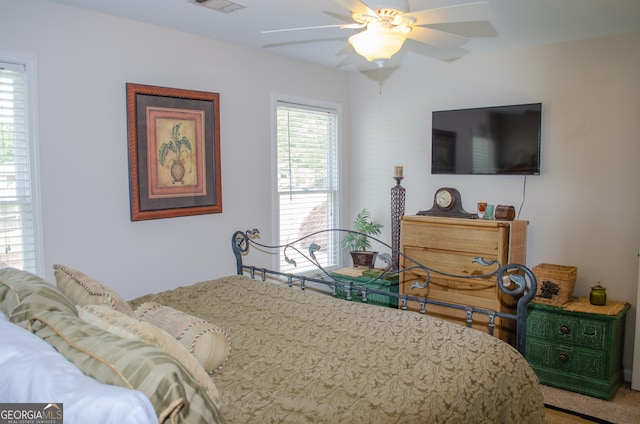 carpeted bedroom with ceiling fan