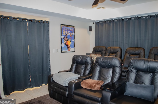 tiled cinema with a ceiling fan