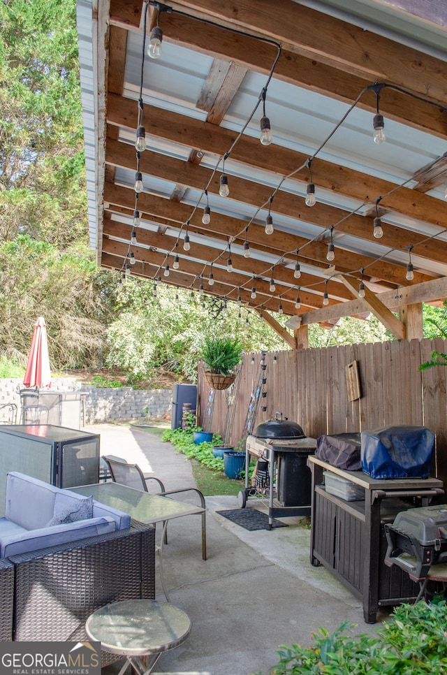 view of patio / terrace featuring fence