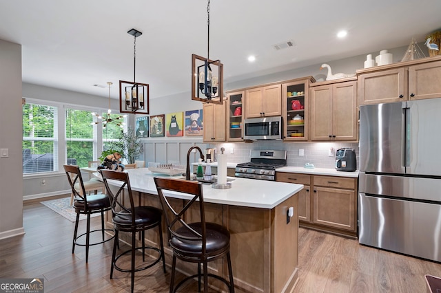 109 Aspen Way, Dallas, GA 30157 - kitchen with light countertops, stainless steel appliances, wood finished floors, and visible vents