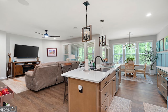 109 Aspen Way, Dallas, GA 30157 - kitchen with dishwasher, a sink, dark wood-type flooring, a center island with sink, and light countertops