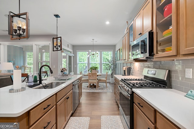 109 Aspen Way, Dallas, GA 30157 - kitchen with a sink, stainless steel appliances, light countertops, decorative backsplash, and dark wood-style floors