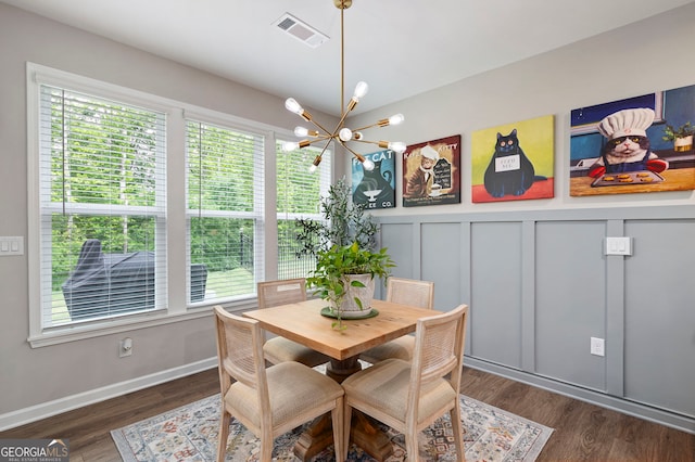 109 Aspen Way, Dallas, GA 30157 - dining space with plenty of natural light, visible vents, wood finished floors, and a notable chandelier
