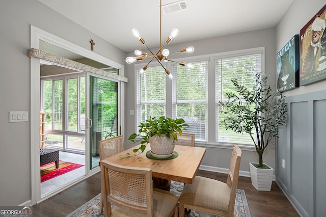 109 Aspen Way, Dallas, GA 30157 - dining area with an inviting chandelier, plenty of natural light, visible vents, and dark wood-style floors