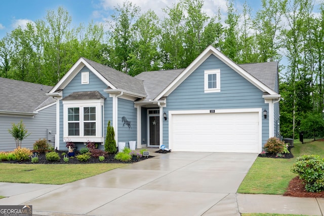 109 Aspen Way, Dallas, GA 30157 - view of front of property featuring concrete driveway, roof with shingles, an attached garage, and a front yard