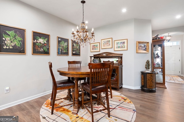 109 Aspen Way, Dallas, GA 30157 - dining space featuring a chandelier, baseboards, arched walkways, and recessed lighting