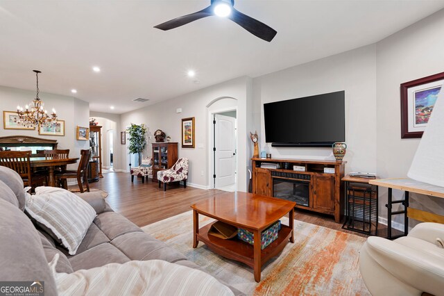 109 Aspen Way, Dallas, GA 30157 - living room featuring ceiling fan with notable chandelier, visible vents, recessed lighting, a glass covered fireplace, and light wood-style floors