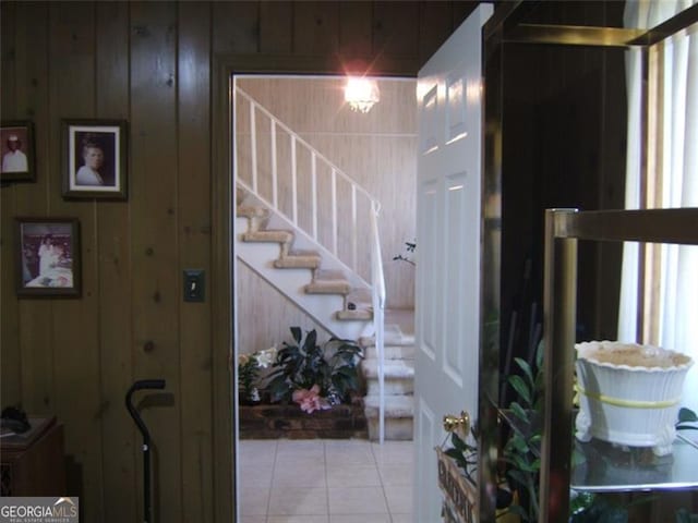 2795 Dodson Lee Dr, East Point, GA 30344 - staircase featuring tile patterned floors and wooden walls