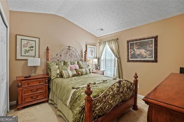 238 Diamond Valley Pass, Canton, GA 30114 - bedroom featuring a textured ceiling, visible vents, a closet, lofted ceiling, and light carpet