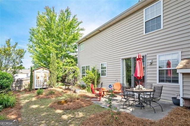 238 Diamond Valley Pass, Canton, GA 30114 - rear view of house with a storage shed, fence, a patio, and an outbuilding