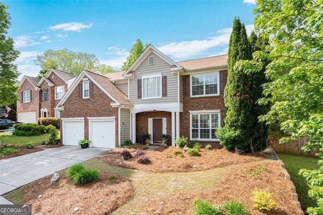 238 Diamond Valley Pass, Canton, GA 30114 - traditional home featuring fence, a garage, driveway, and brick siding
