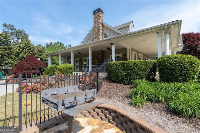 238 Diamond Valley Pass, Canton, GA 30114 - view of front of house featuring a porch, fence, a ceiling fan, and a chimney