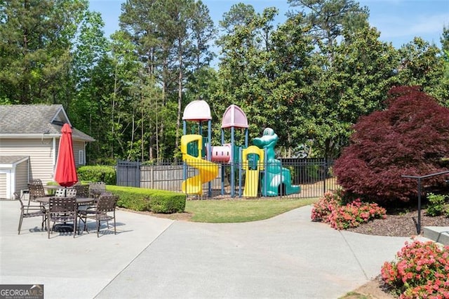 238 Diamond Valley Pass, Canton, GA 30114 - communal playground with fence, a shed, a patio area, an outbuilding, and outdoor dining space