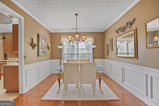 238 Diamond Valley Pass, Canton, GA 30114 - dining area with light wood-type flooring, a decorative wall, and a chandelier