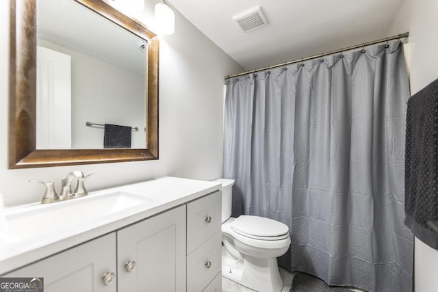 bathroom with vanity, toilet, tile patterned floors, a shower with curtain, and visible vents