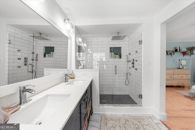 45 Michelle Cir NE, Atlanta, GA 30342 - bathroom featuring a stall shower, double vanity, and wood finished floors