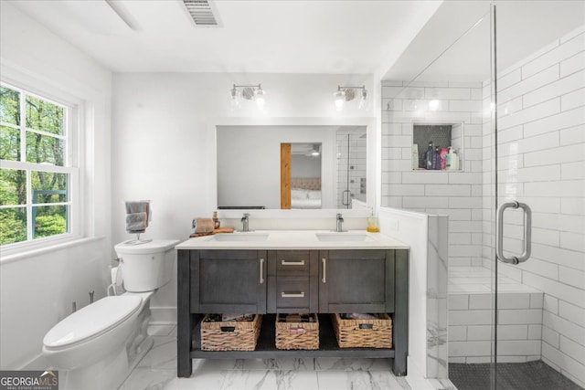 45 Michelle Cir NE, Atlanta, GA 30342 - full bathroom with healthy amount of natural light, double vanity, marble look tile flooring, and toilet