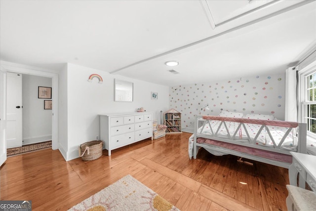 45 Michelle Cir NE, Atlanta, GA 30342 - bedroom with wallpapered walls, light wood-type flooring, and baseboards