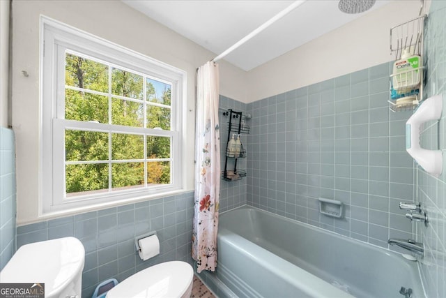 45 Michelle Cir NE, Atlanta, GA 30342 - full bath featuring toilet, tile walls, plenty of natural light, and shower / bath combination with curtain