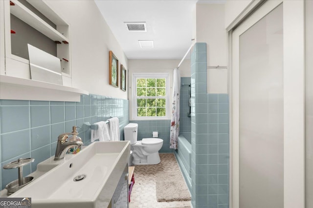 45 Michelle Cir NE, Atlanta, GA 30342 - bathroom with tile walls, toilet, shower / bath combination with curtain, and vanity