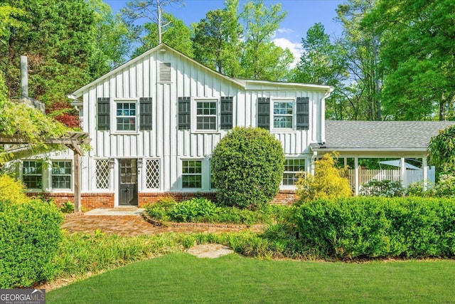 45 Michelle Cir NE, Atlanta, GA 30342 - view of front of house featuring board and batten siding, brick siding, and a front lawn