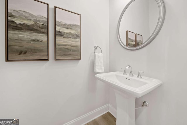 bathroom featuring baseboards and wood finished floors