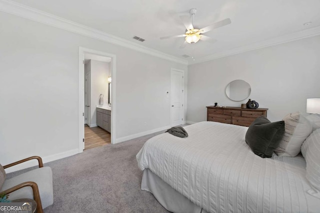 bedroom with visible vents, ornamental molding, baseboards, ceiling fan, and carpet flooring