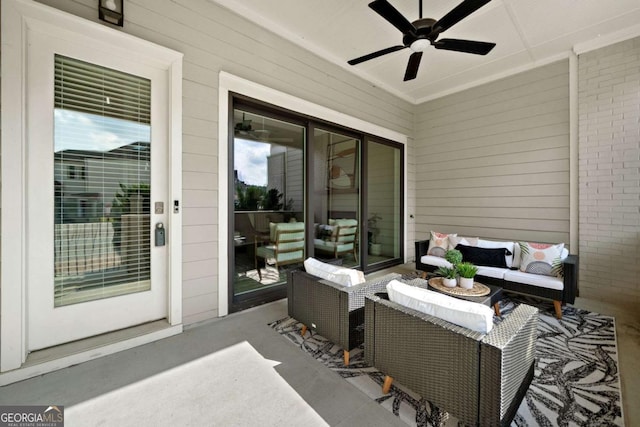 view of patio with an outdoor living space and a ceiling fan