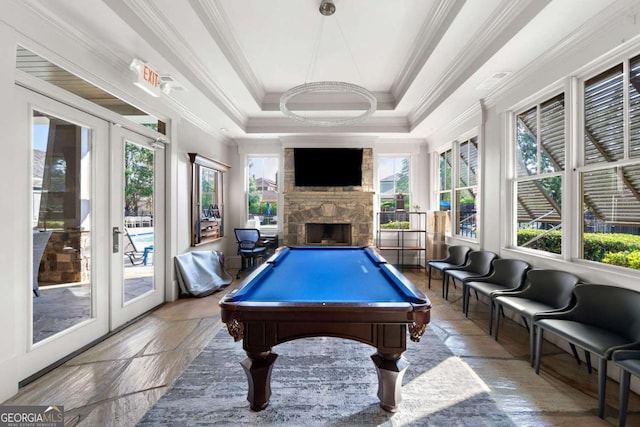 recreation room featuring crown molding, billiards, a fireplace, and french doors
