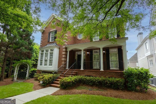 2174 Basque Dr SE, Smyrna, GA 30080 - view of front of house featuring a porch and brick siding